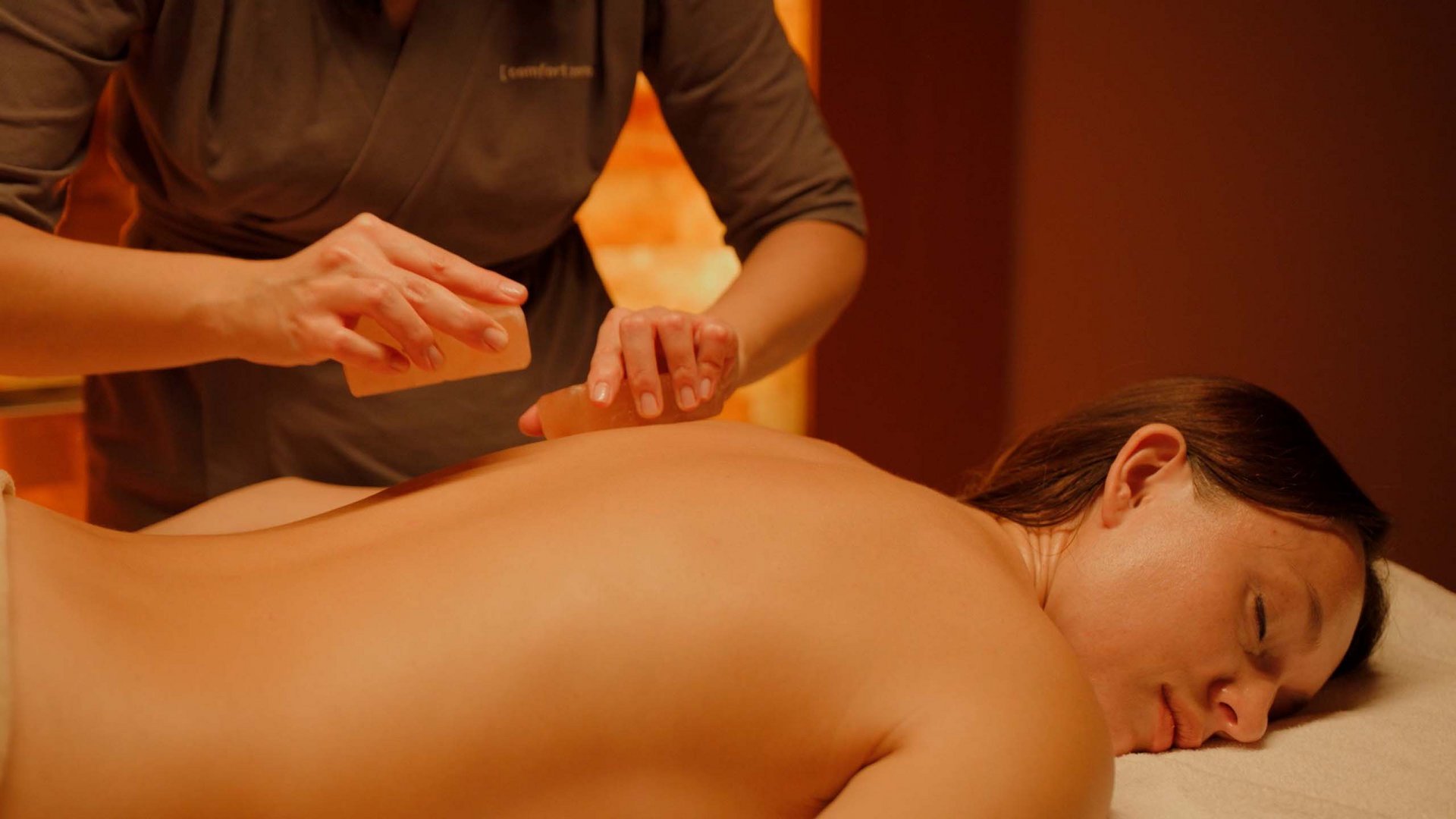 A holiday near Assisi: activities galore Woman receiving a relaxing hot stone massage on her back