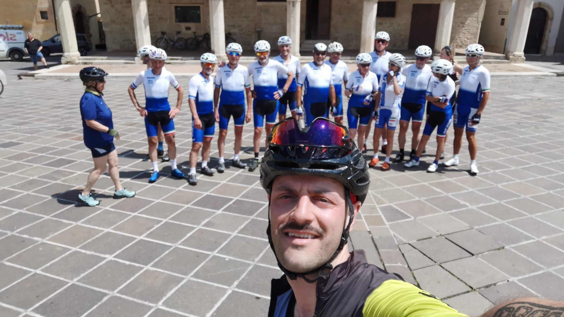 A holiday near Assisi: activities galore Group of cyclists in white and blue kits with man taking a selfie