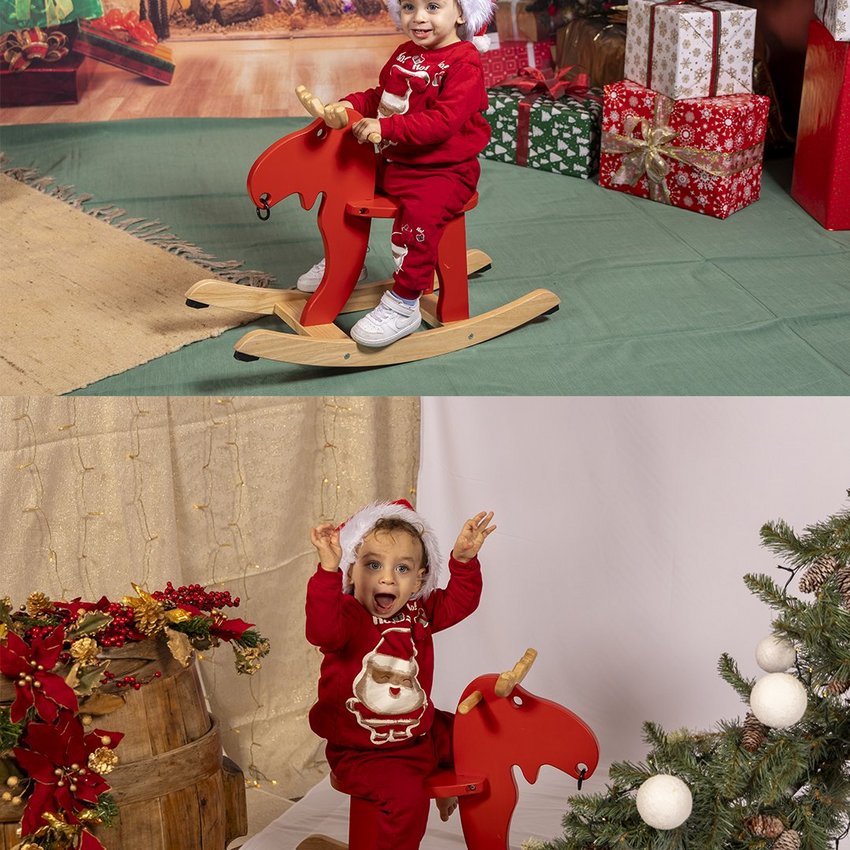 Ponte dell'Immacolata a Valle di Assisi Bambino con cappello di Babbo Natale su cavallo a dondolo rosso davanti ad alberi di natale e regali